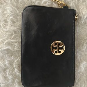 Tory Burch wristlet black with gold hardware. Removable hand strap.